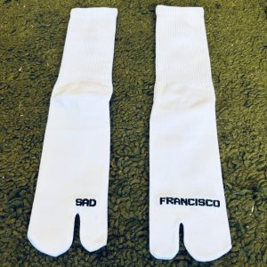 Sad Francisco tabi socks. White with black lettering.